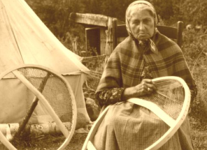 Historic  photo of woman making bearpaw snowshoes