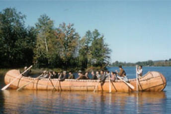 A large Ojibwa freight canoe paddled by  maen from Pikwakanagan Reserve.